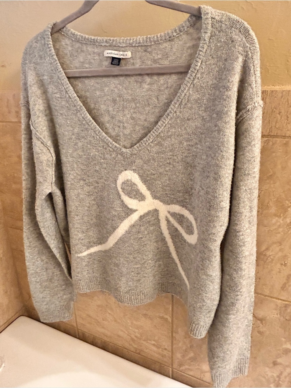 American Eagle Outfitters Gray V-Neck Sweater with Cream Bow